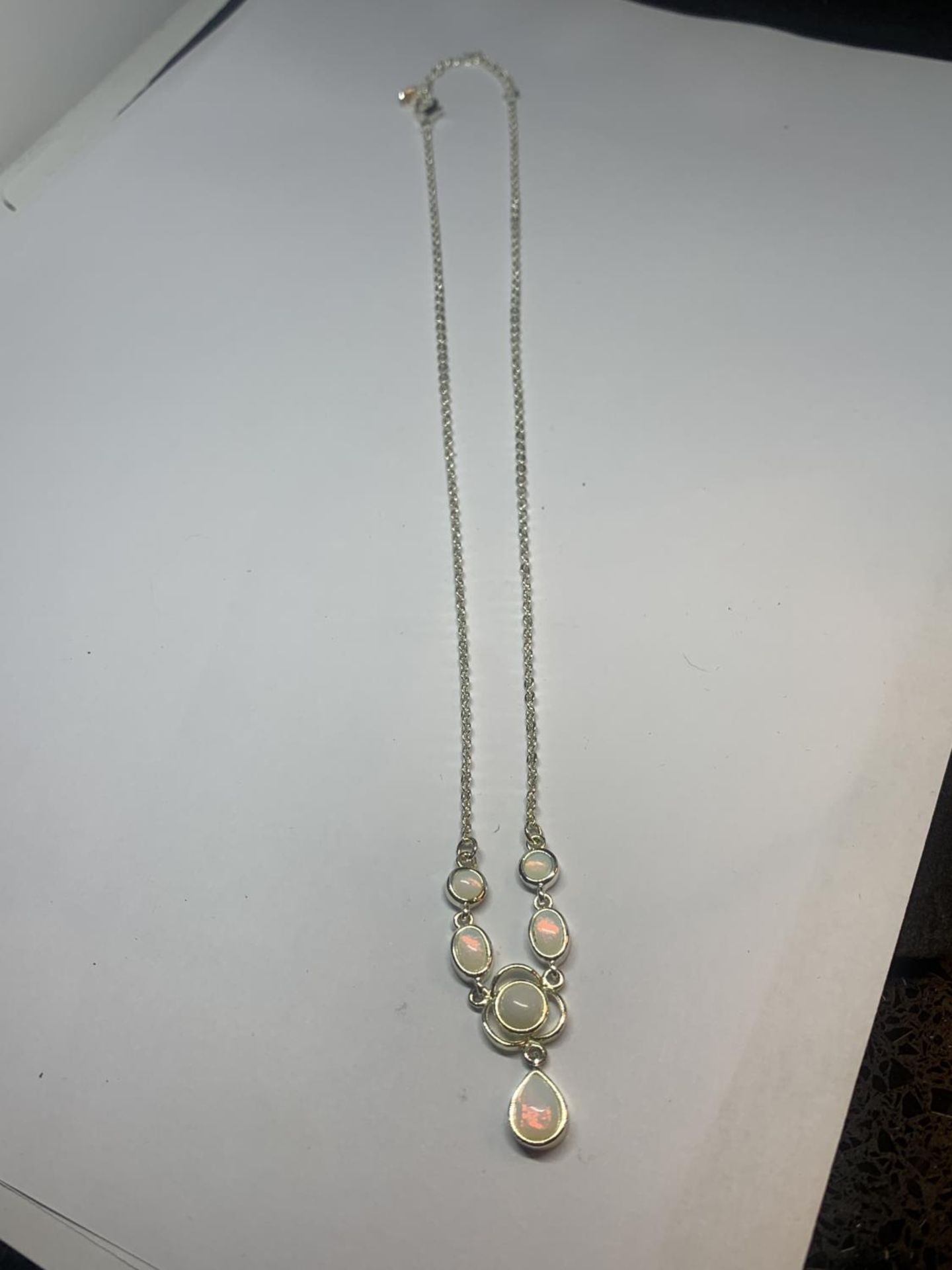 AN OPAL NV NECKLACE IN A PRESENTATION BOX