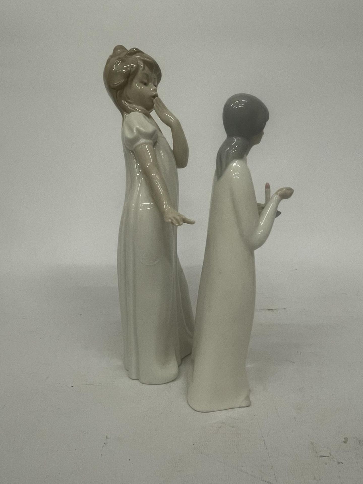 A NAO FIGURE OF A GIRL YAWNING TOGETHER WITH A MIQUEL REQUENA S.A. FIGURE OF A GIRL HOLDING A CANDLE - Image 2 of 4