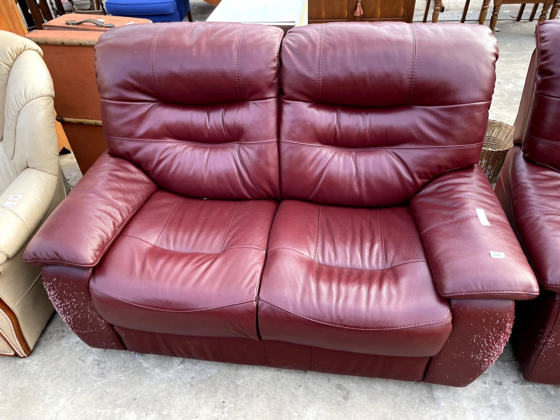 A MODERN LEATHER TWO SEATER SETTEE