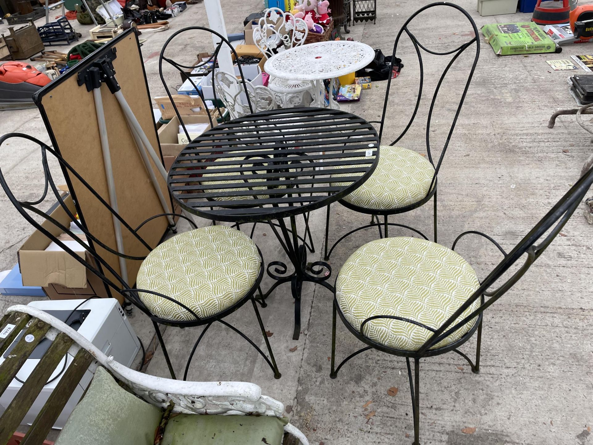 A DECORATIVE METAL PATIO BISTRO SET COMPRISING OF A ROUND TABLE AND FOUR CHAIRS WITH CUSHION SEATS - Image 2 of 3