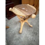 A HARDWOOD, POSSIBLY AFRICAN CARVED INTERLOCKING OCCASIONAL TABLE - 16" DIAMETER