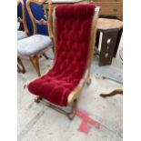 A VICTORIAN STYLE MAROON BUTTONED SLIPPER CHAIR