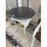 A VINTAGE PUB TABLE WITH CAST IRON BASE AND WOODEN TOP