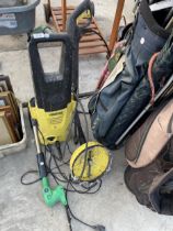 A KARCHER PRESSURE WASHER AND AN ELECTRIC HEDGE TRIMMER
