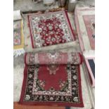 TWO SMALL RED PATTERNED RUGS