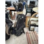 TWO GOLF BAGS AND AN ASSORTMENT OF VINTAGE GOLF CLUBS