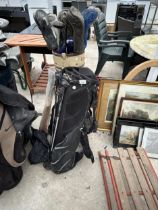 TWO GOLF BAGS AND AN ASSORTMENT OF VINTAGE GOLF CLUBS