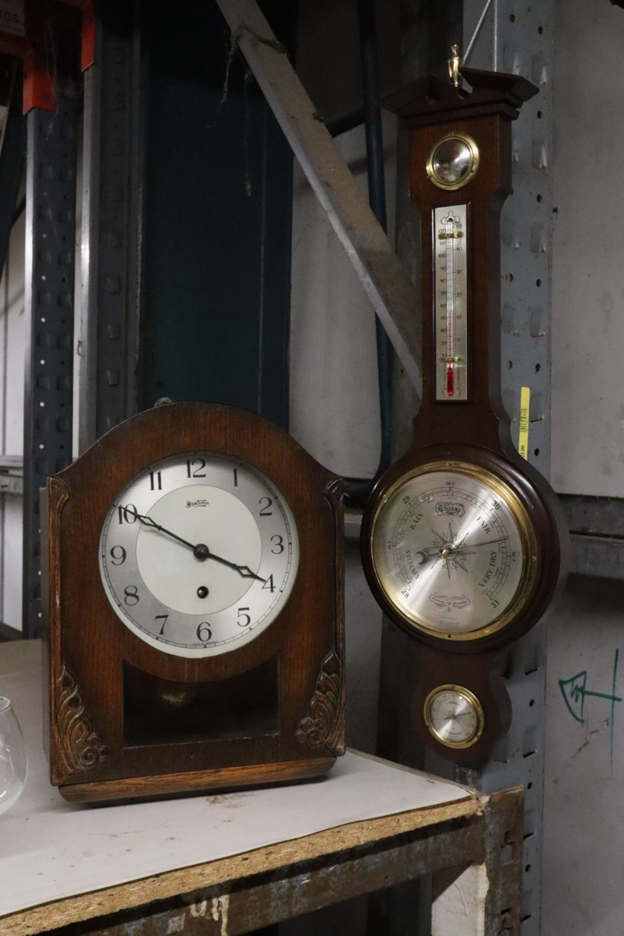 A VINTAGE MAHOGANY CASED MANTLE CLOCK AND BAROMETER