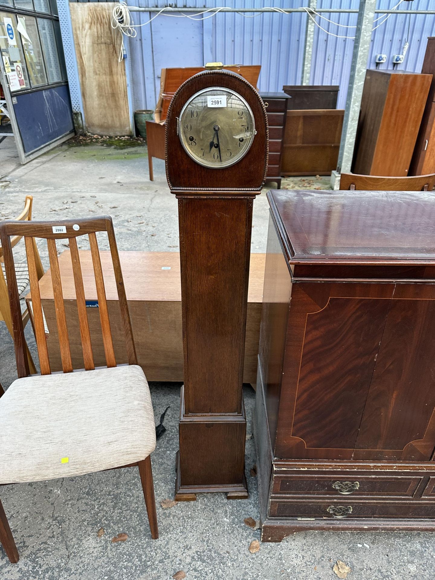 A MID CENTURY OAK GRANDMOTHER CLOCK WITH HALLER MOVEMENT