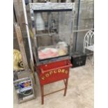 A VINTAGE TWO WHEELED POPCORN SELLERS TROLLEY