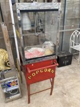 A VINTAGE TWO WHEELED POPCORN SELLERS TROLLEY