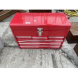 A RED METAL WORKSHOP TOOL BOX WITH SIX DRAWERS AND A TOP STORAGE COMPARTMENT