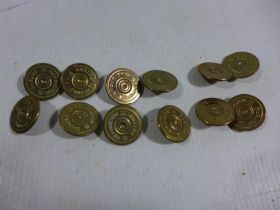 A SET OF TWELVE REMINGTON TWELVE GAUGE SHOTGUN BUTTONS