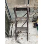 A VINTAGE WOODEN TWO RUNG STEP LADDER