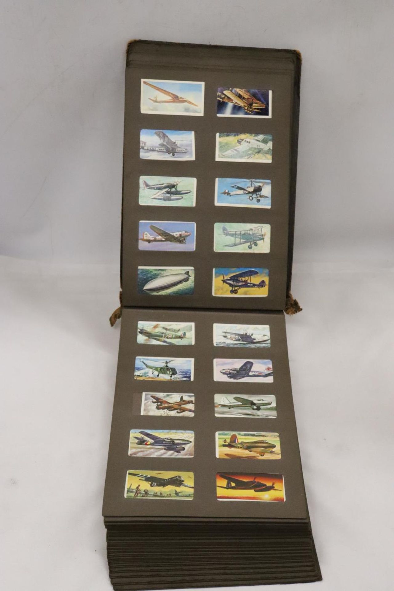 AN ALBUM CONTAINING A COLLECTION OF CIGARETTE CARDS - Image 4 of 6