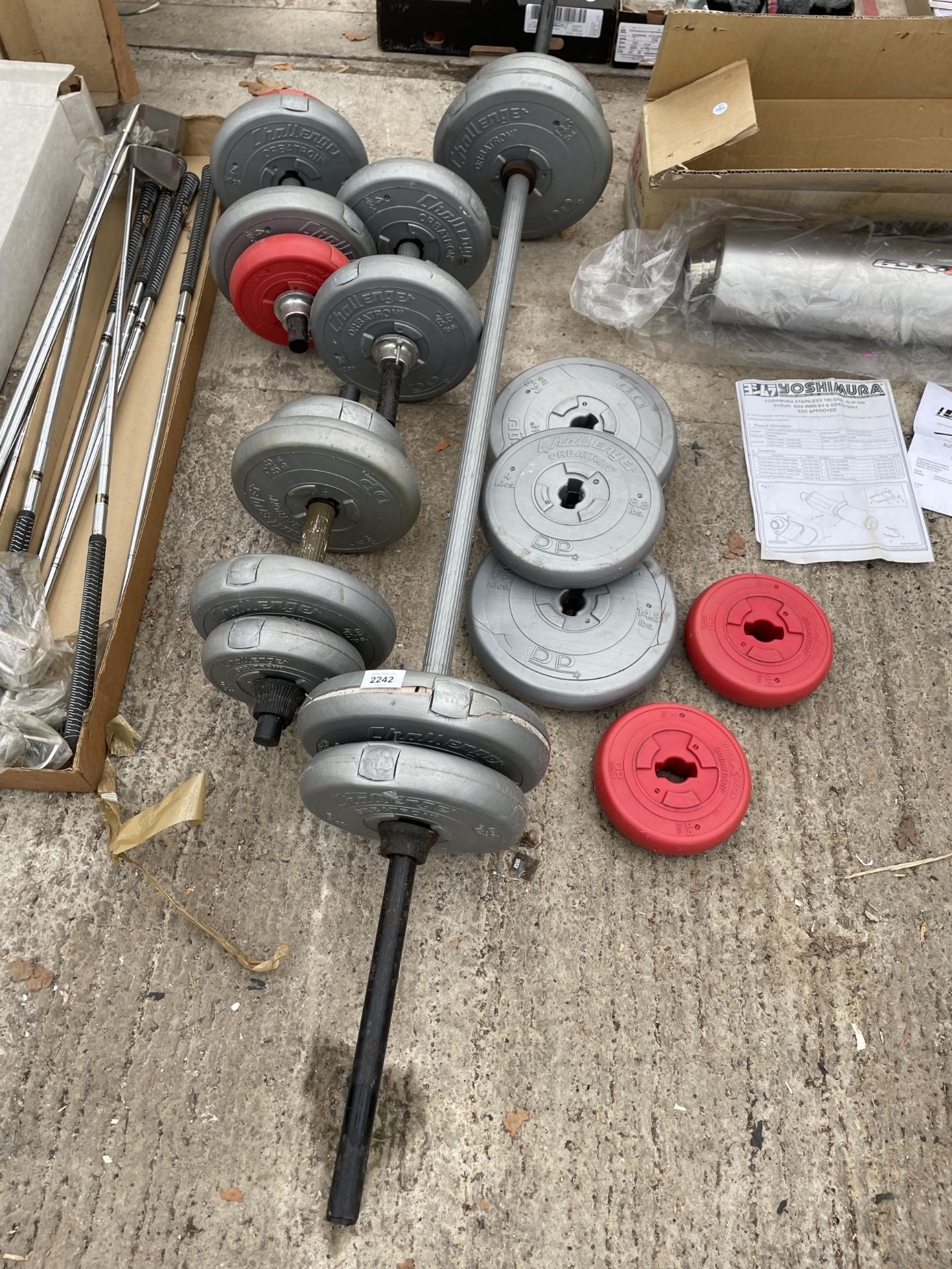 AN ASSORTMENT OF WEIGHT LIFTING WEIGHTS, BARS AND DUMBELLS ETC