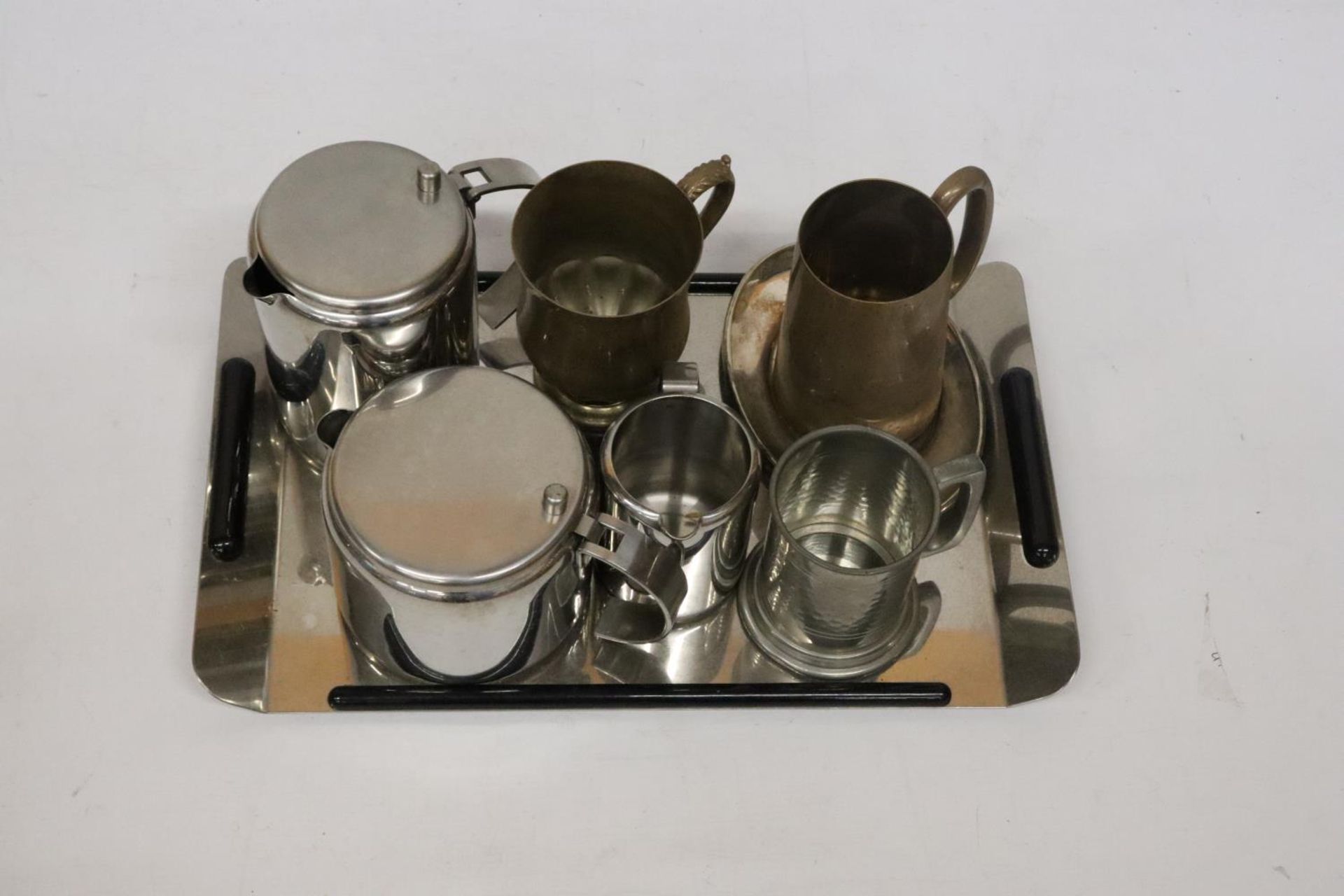 TWO BRASS TANKARDS, A PEWTER TANKARD, STAINLESS STEEL TEA POT, HOT WATER JUG AND CREAM JUG ON A TRAY - Image 3 of 5