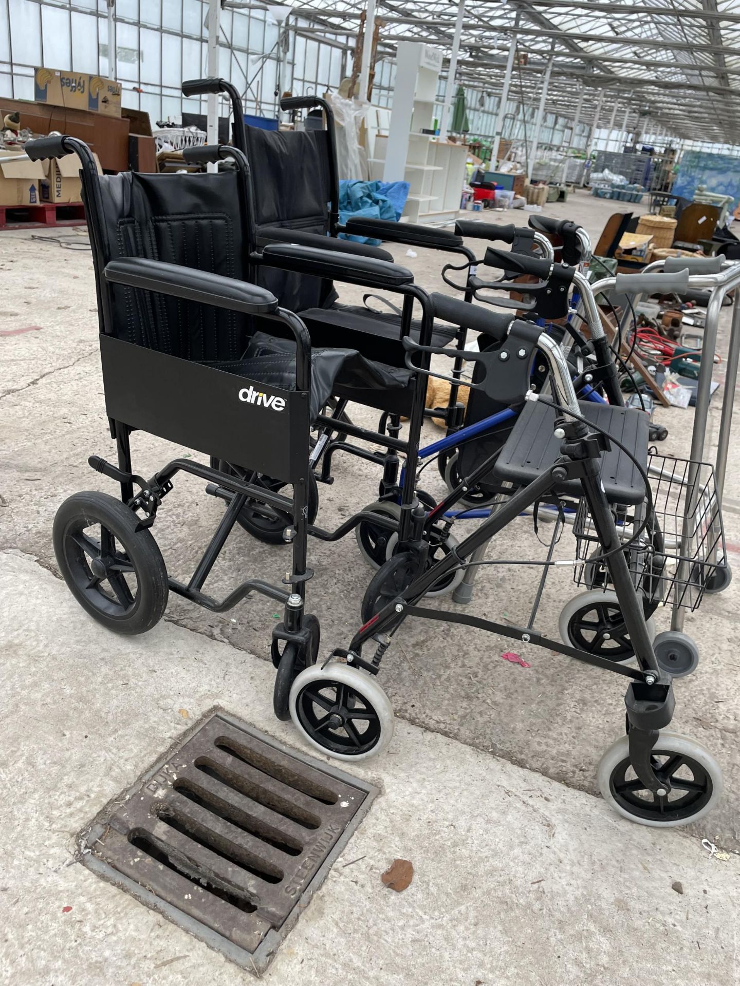 AN ASSORTMENT OF MOBILITY AIDS TO INCLUDE TWO WHEEL CHAIRS AND WALKING FRAMES ETC - Image 2 of 5