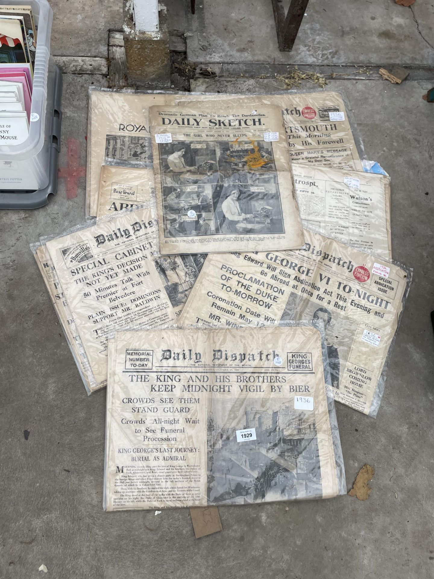 AN ASSORTMENT OF VINTAGE NEWSPAPERS