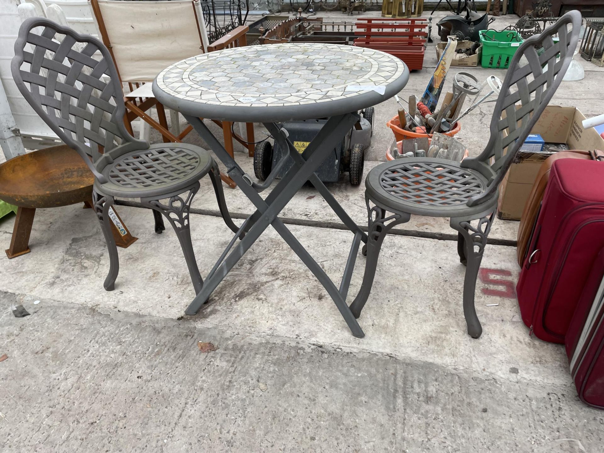 A METAL BISTRO SET COMPRISNG OF TWO CHAIRS AND A TILE TOP TABLE - Image 2 of 3
