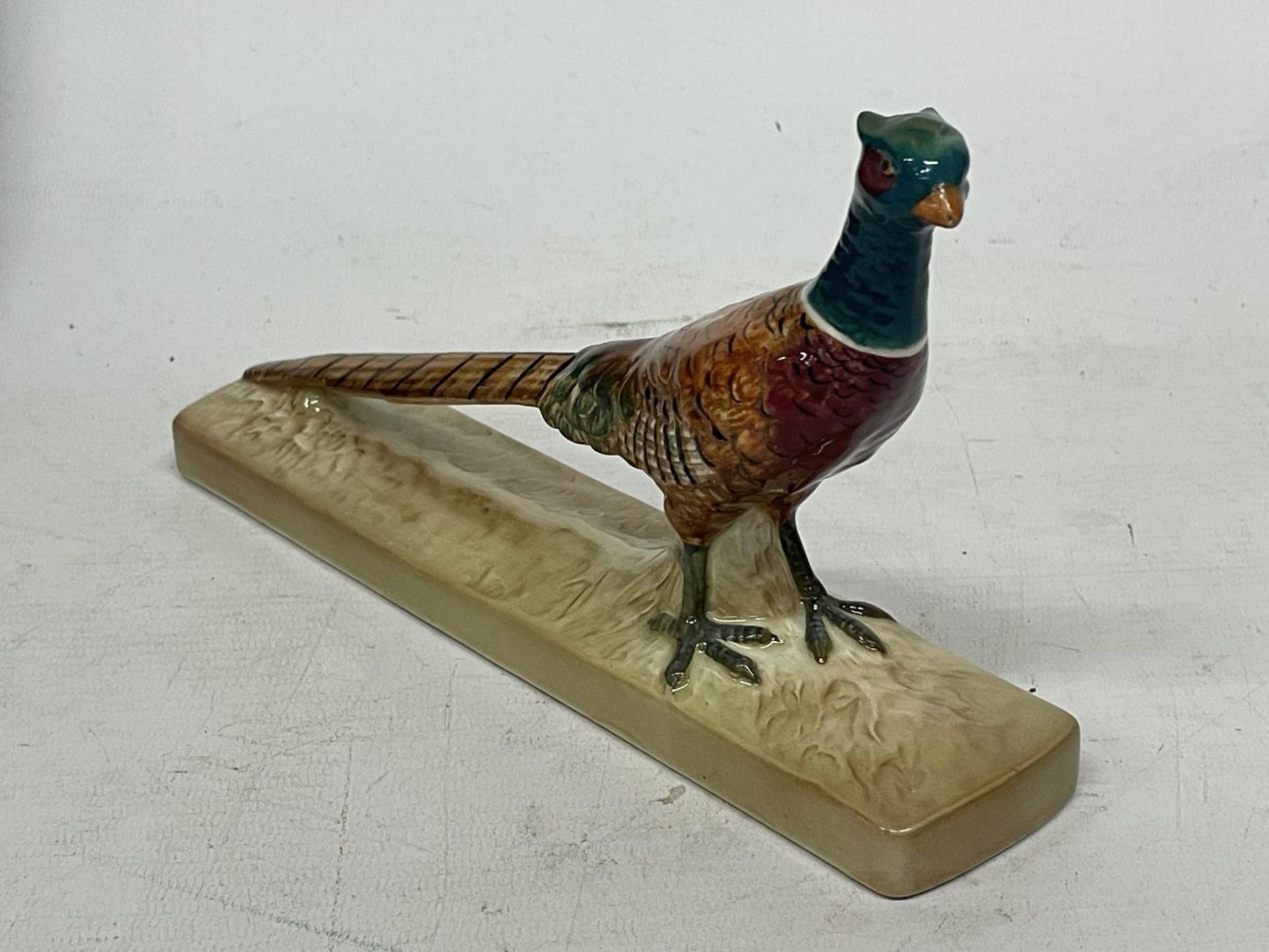 A BESWICK PHEASANT ON CERAMIC BASE NO. 1774