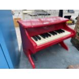 A MINIATURE CHILDS PIANO