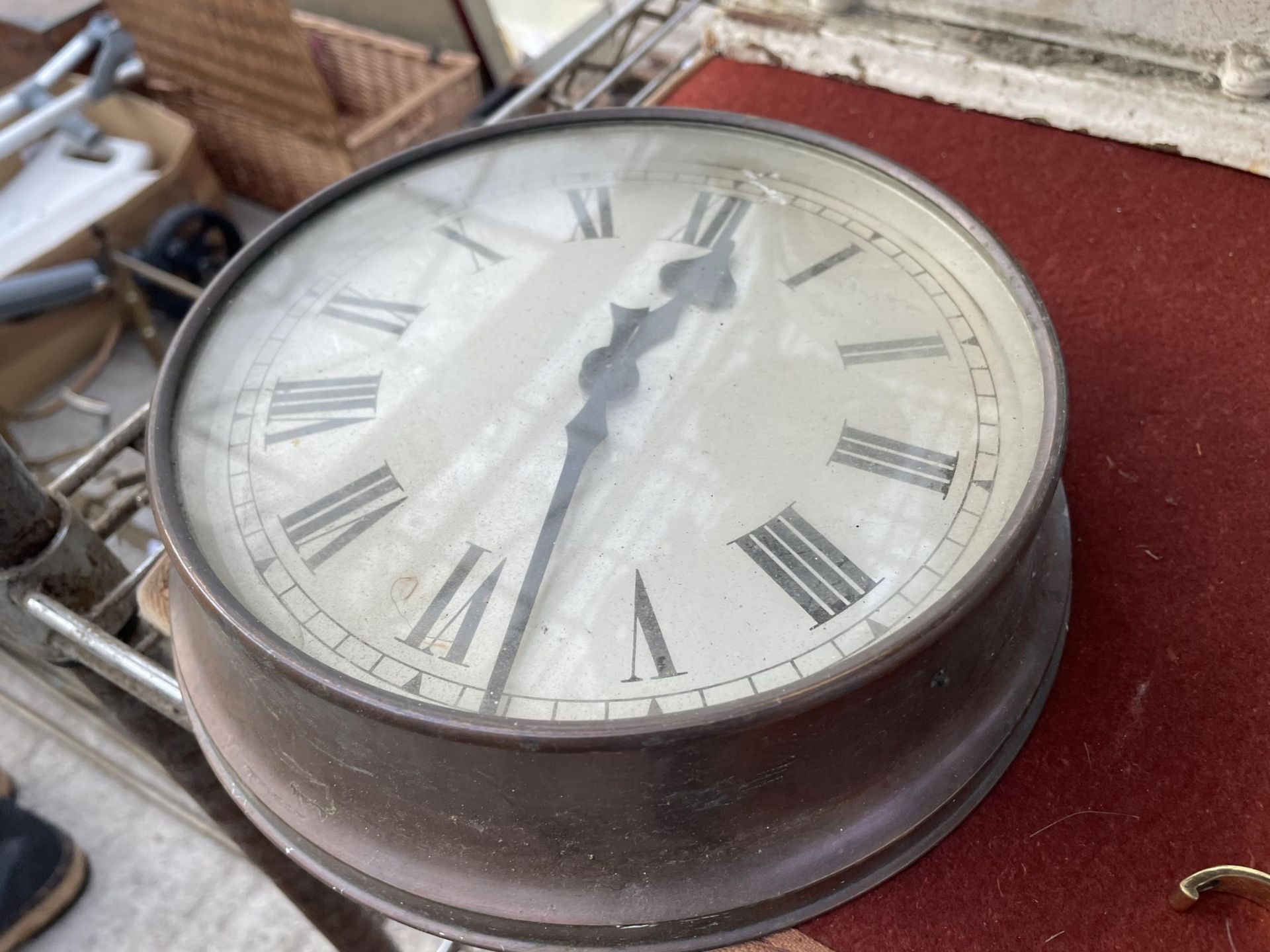 A VINTAGE COPPER WALL CLOCK