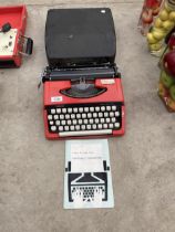 A PORTABLE BROTHER DELUXE 220 TYPEWRITER WITH CARRY CASE
