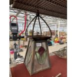 A VINTAGE METAL AND STAIN GLASS CIELING LANTERN