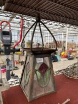 A VINTAGE METAL AND STAIN GLASS CIELING LANTERN