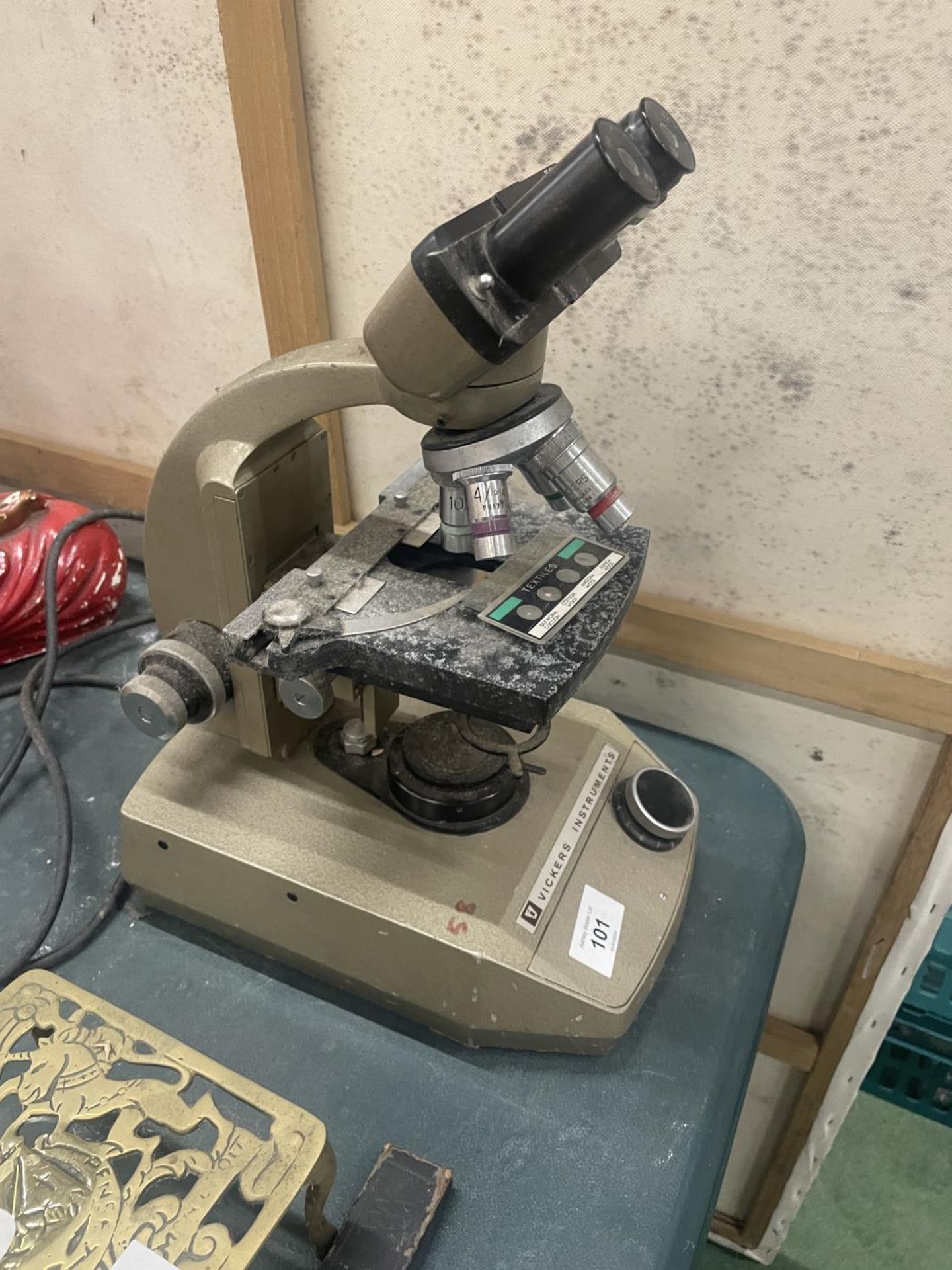 A VICKERS INSTRUMENTS VINTAGE MICROSCOPE WITH A TEXTILES SLIDE