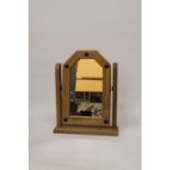 A GOTHIC STYLE, SWINGING DRESSING TABLE MIRROR
