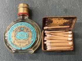 A VINTAGE BLUE AND GOLD EAU DE COLOGNE AND A TIN OF MATCHES