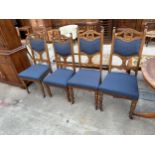 A SET OF FOUR ART NOUVEAU DINING CHAIRS ON TURNED FRONT LEGS