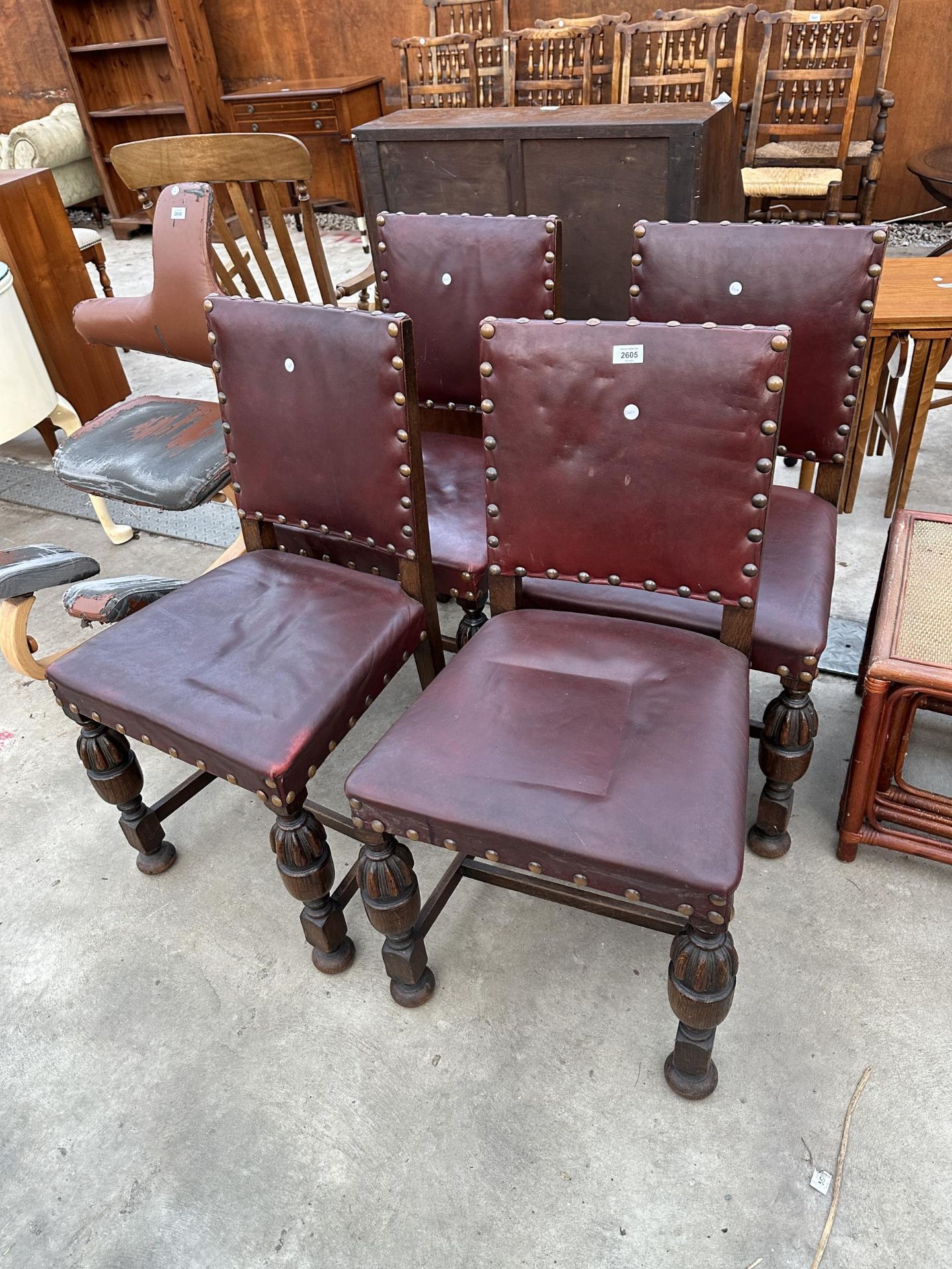 A SET OF FOUR OAK EARLY 20TH CENTURY JACOBEAN STYLE CHAIRS