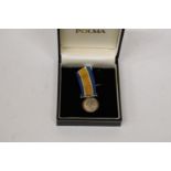 A WORLD WAR I SILVER MINIATURE WAR MEDAL AND RIBBON