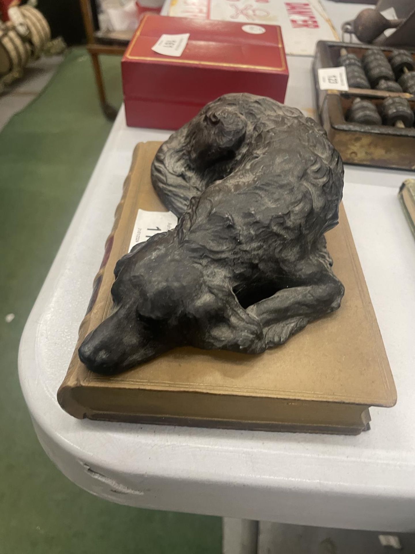 A HEAVY MODEL OF A SLEEPING DOG ON A STONEWARE BOOK, LENGTH 18CM, HEIGHT 7CM - Image 2 of 3
