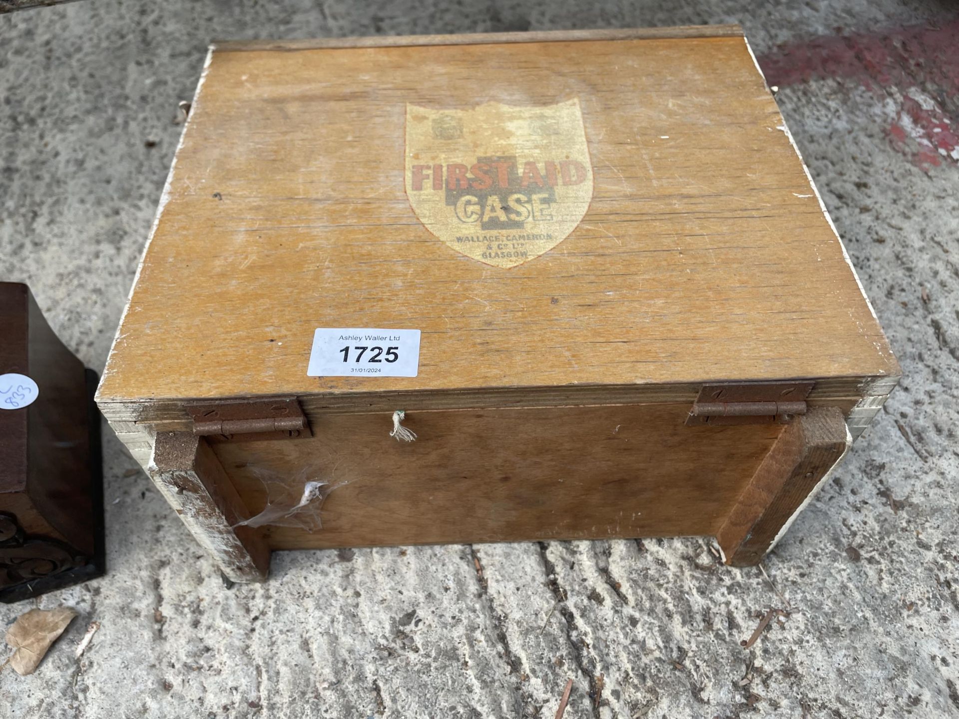 A VINTAGE WOODEN CASED FIRST AID KIT