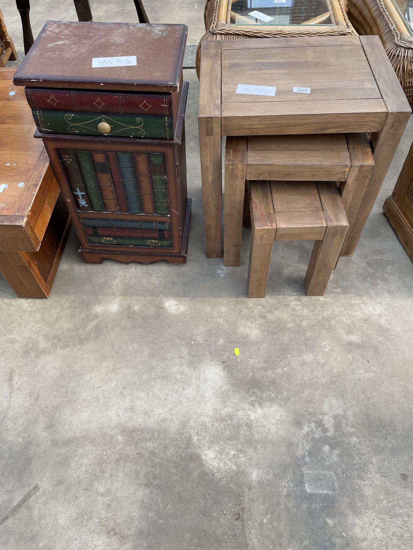 A MODERN NEST OF THREE TABLES AND LI-LO BESDIE LOCKER IN THE FORM OF A STACK OF BOOKS