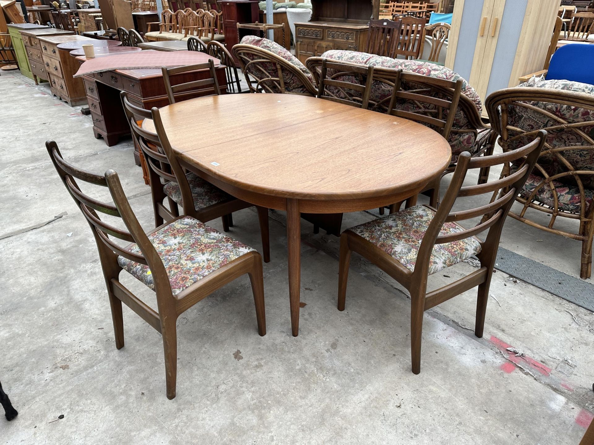 A G-PLAN RETRO TEAK EXTENDING DINING TABLE, 64 X 44" (LEAF 18") AND SIX LADDERBACK DINING CHAIRS