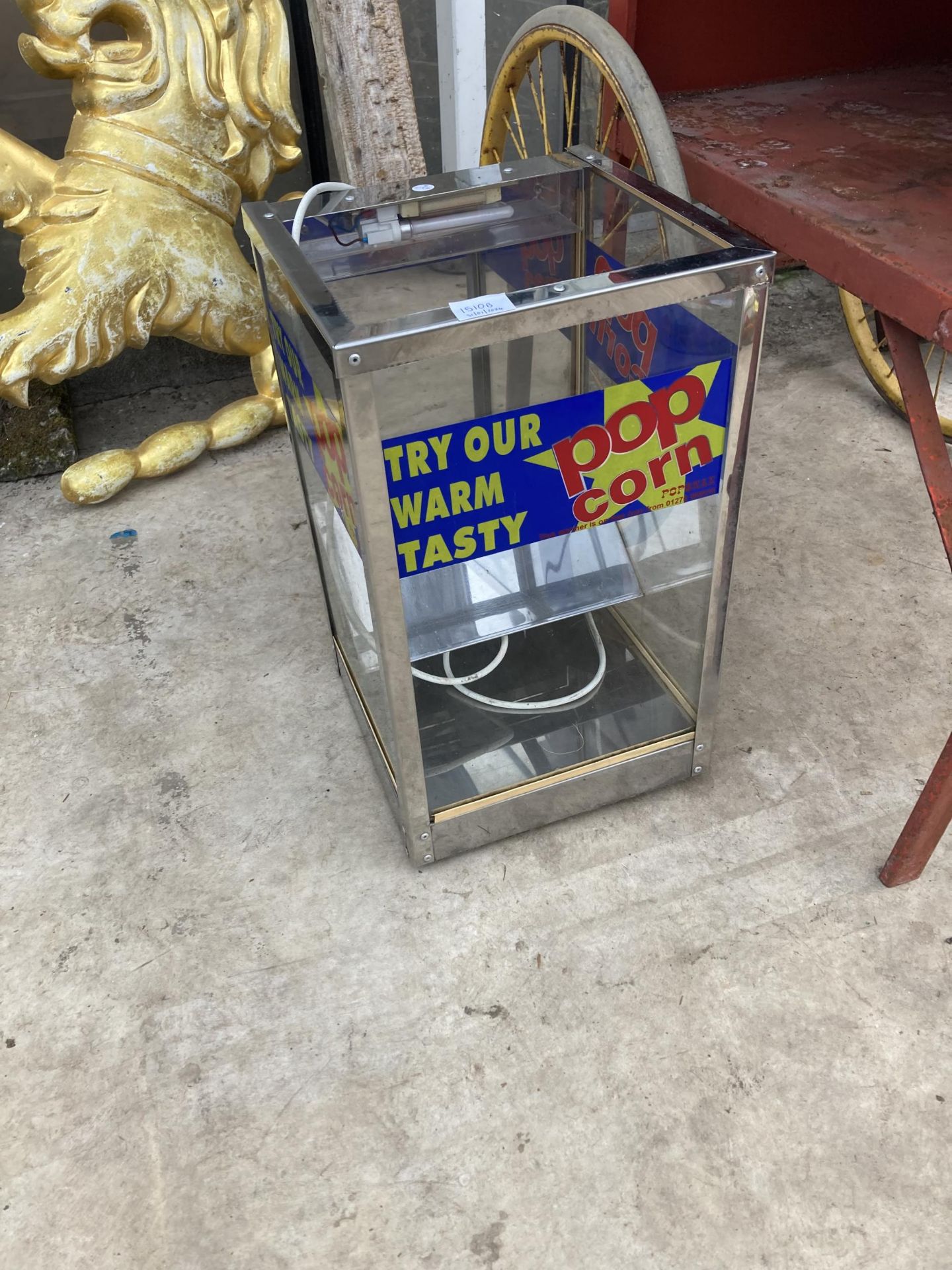 AN ELECTRIC POPCORN WARMING DISPLAY UNIT