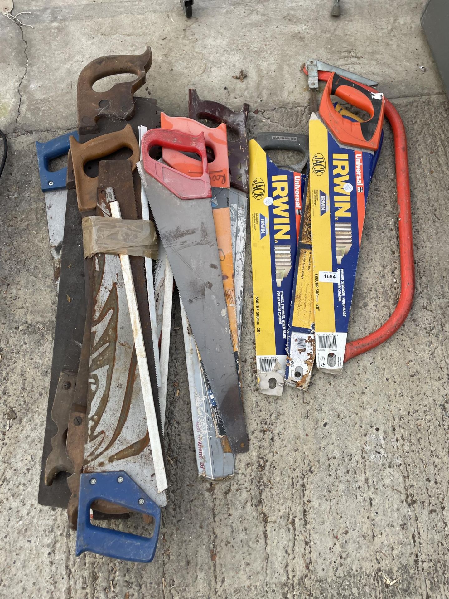 A LARGE ASSORTMENT OF VARIOUS HAND SAWS