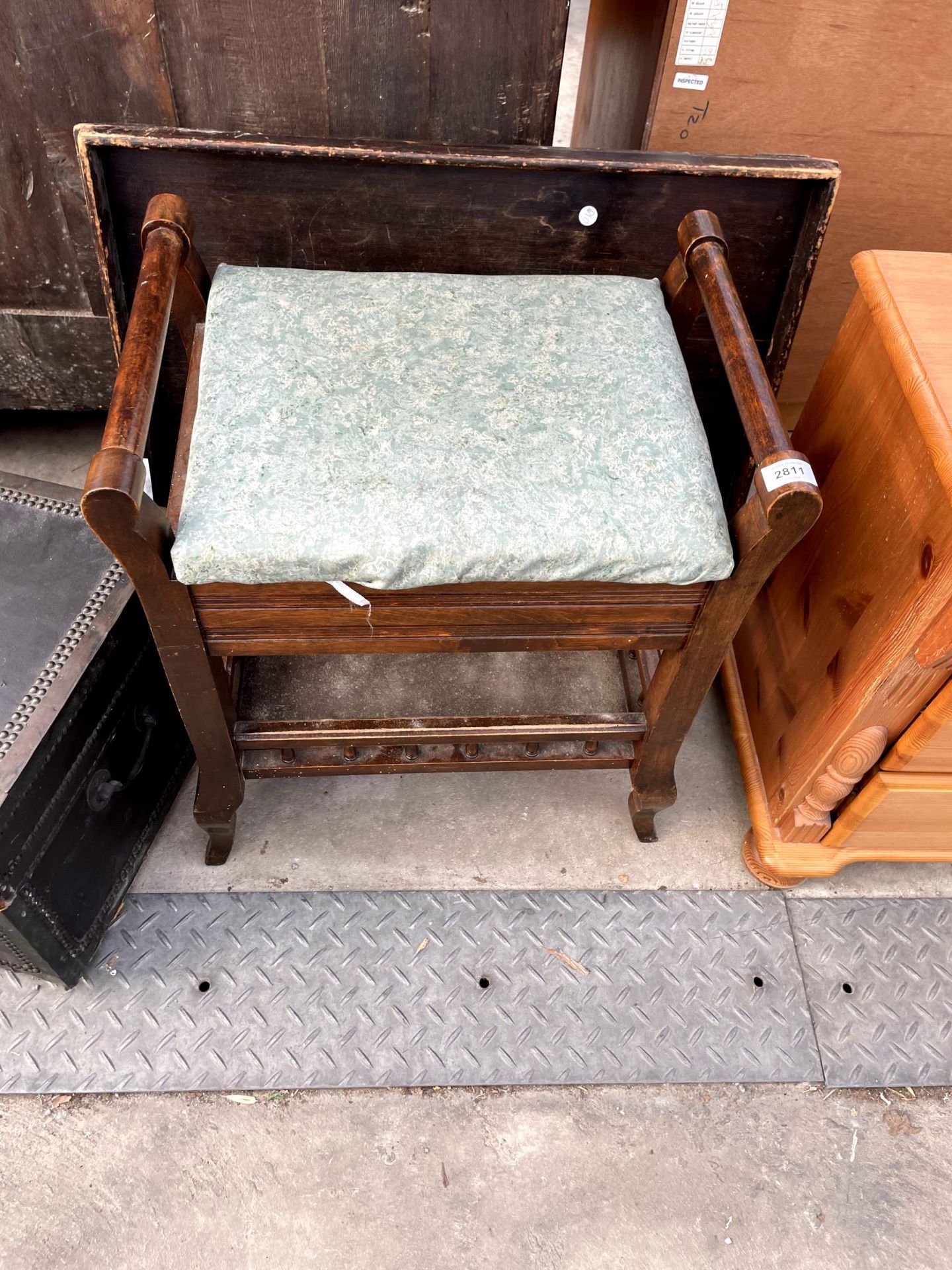 AN EDWARDIAN BEECH PIANO STOOL WITH LIFT-UP LID AND BED TABLE