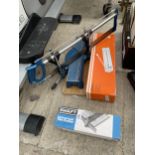 A MITRE SAW AND TWO TILE CUTTERS