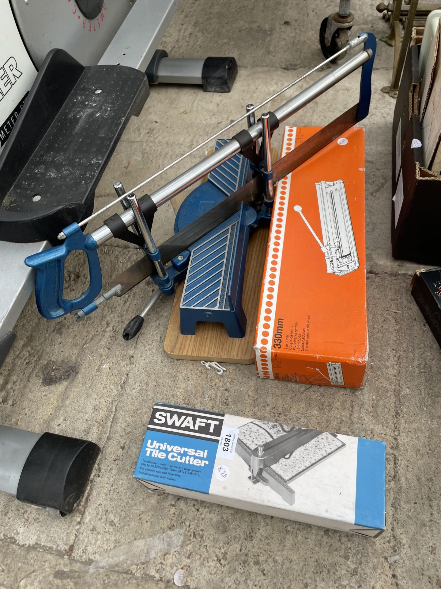 A MITRE SAW AND TWO TILE CUTTERS