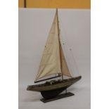 A LARGE WOODEN MODEL OF A SAILING BOAT ON A WOODEN STAND, HEIGHT 104CM, WIDTH 75CM