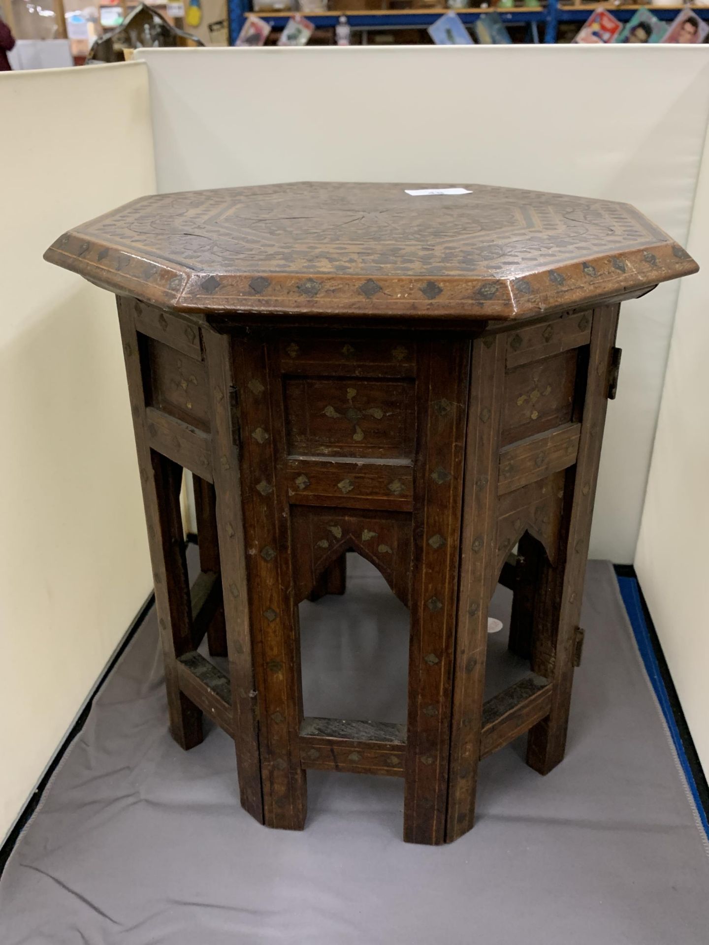 A LATE 19TH CENTURY INDIAN OCTAGONAL TABLE WITH BRASS INLAY