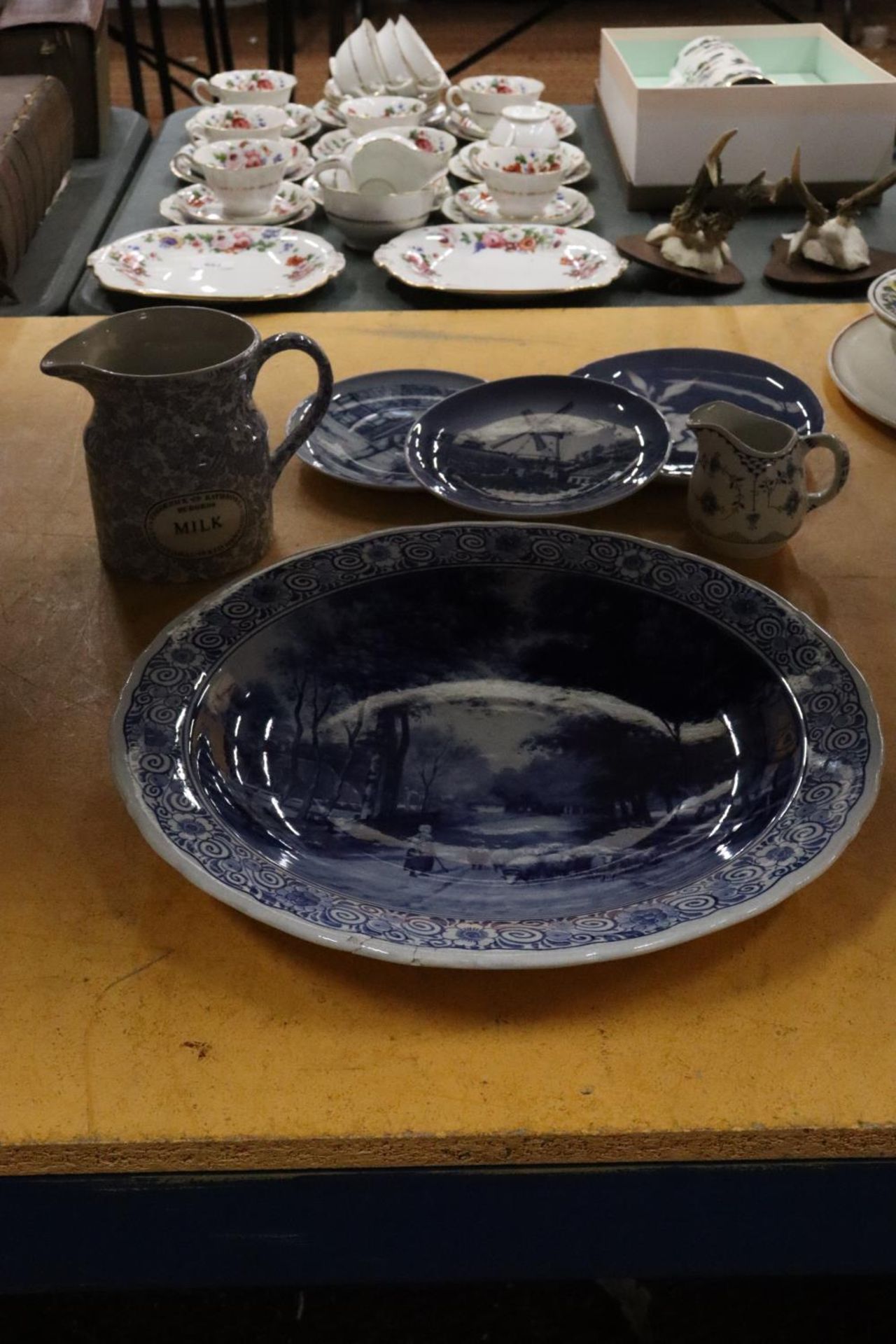 A LARGE VINTAGE BLUE AND WHITE DELFT BOWL, DIAMETER 39CM - A/F, ONE PART OF THE RIM HAS BEEN