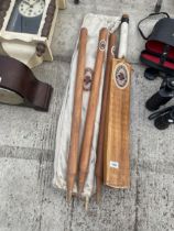 A VINTAGE WOODEN 'FOSTER BREWING CO.' CRICKET BAT AND STUMPS