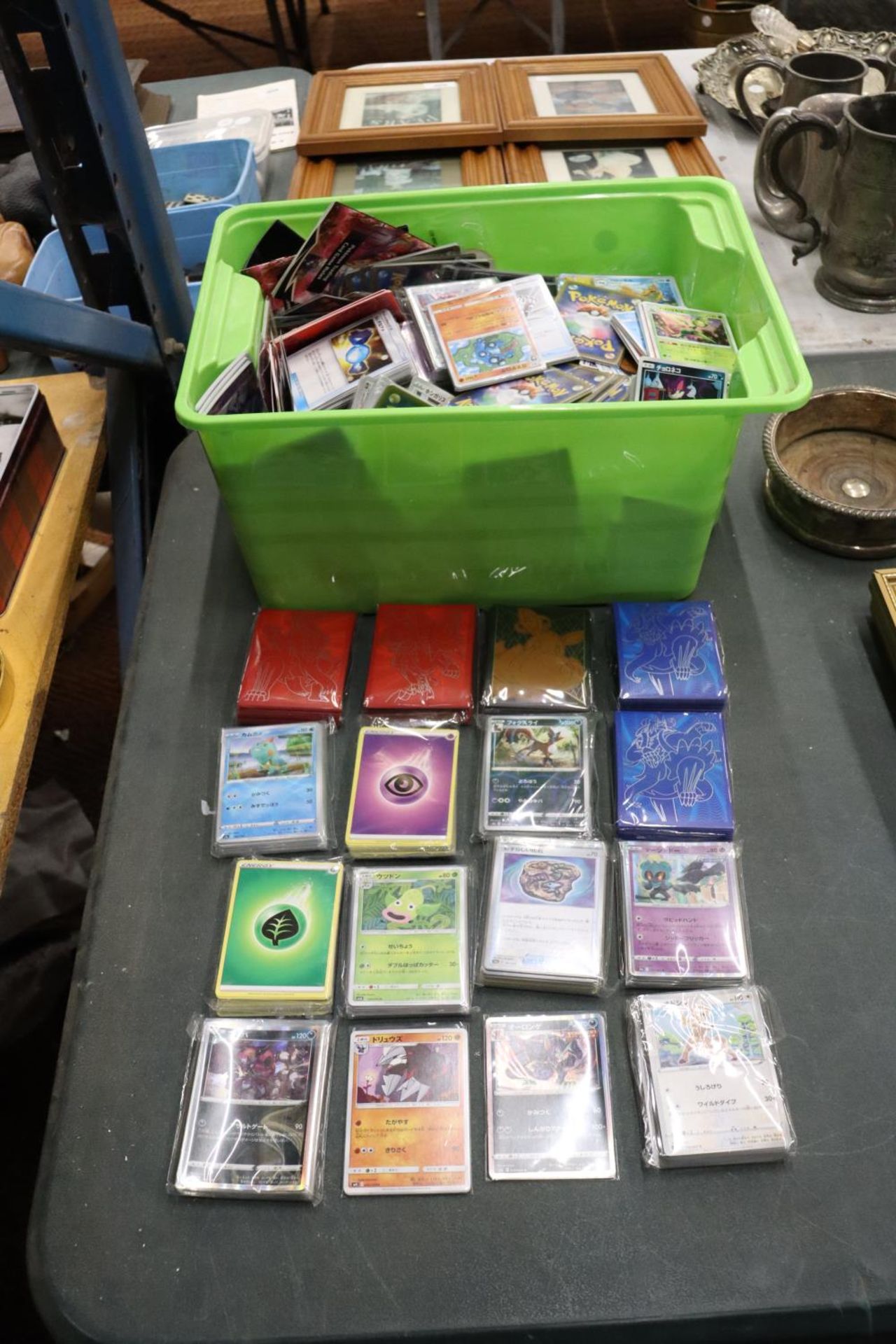 A LARGE COLLECTION OF JAPANESE POKEMON CARDS AND SLEEVES